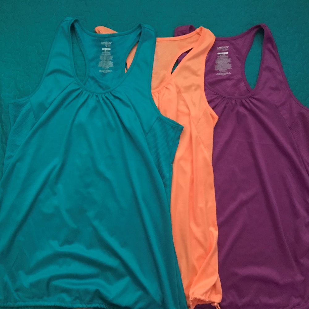 4 DANSKIN ATHLETIC TANK TOPS 4 @ $20